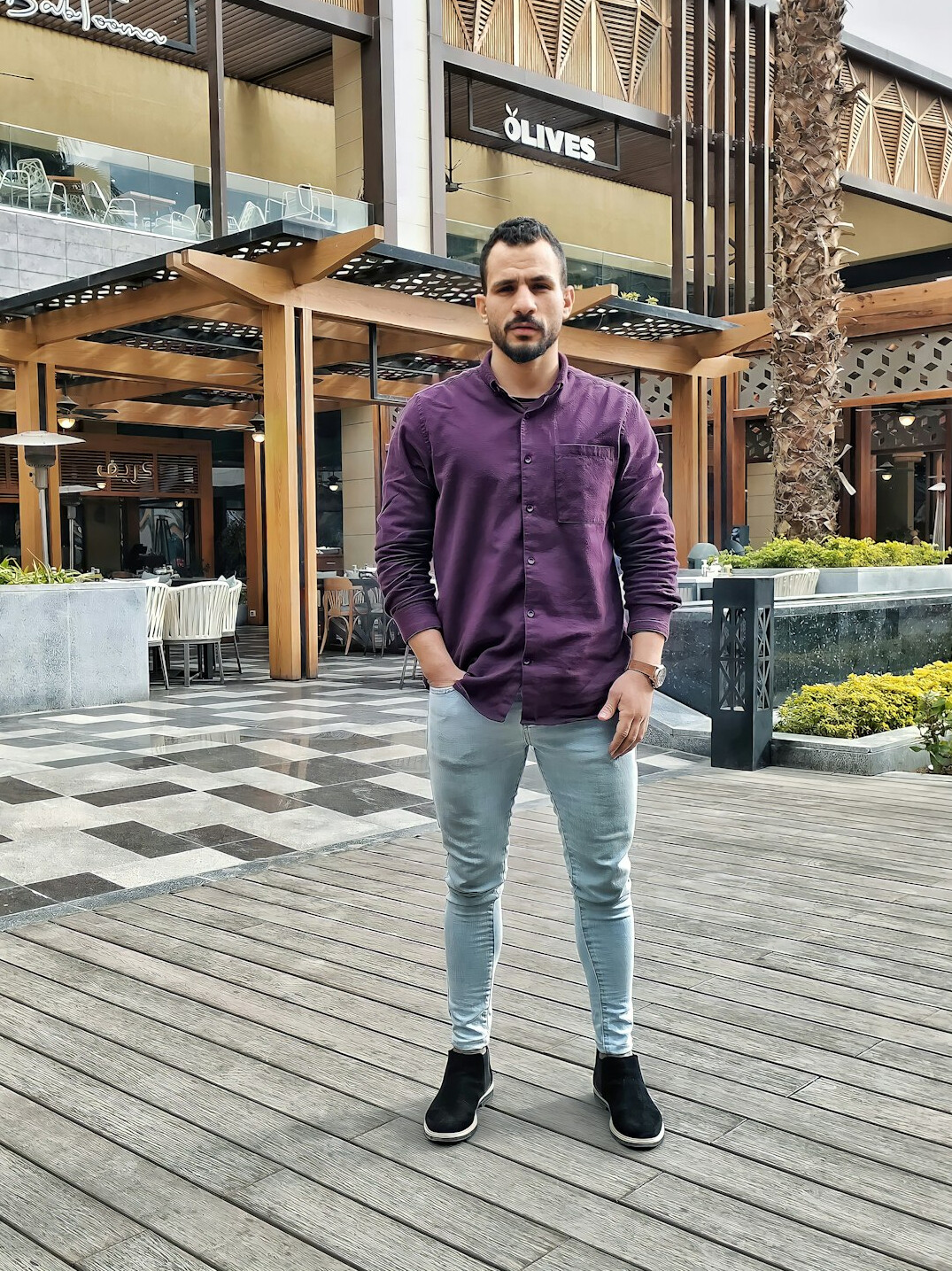 Turkish man media trainer in business casual attire